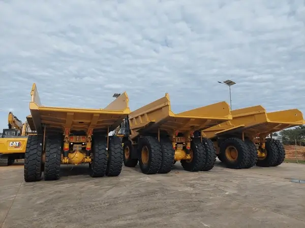 A fleet of modern dump trucks lined up